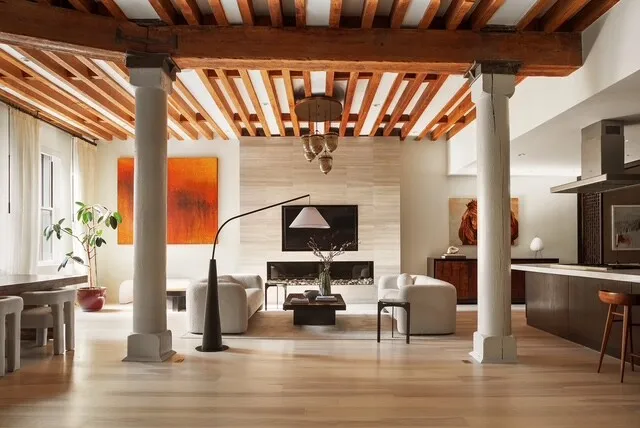 a view of living room with furniture and fireplace