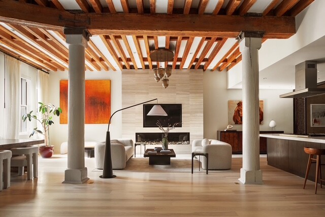 a view of living room with furniture and fireplace