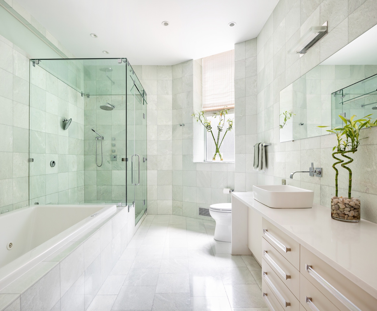 362 West Broadway, Unit 2 Manhattan, NY 10013 - Photo 10 of 13 a spacious bathroom with a tub sink shower and mirror