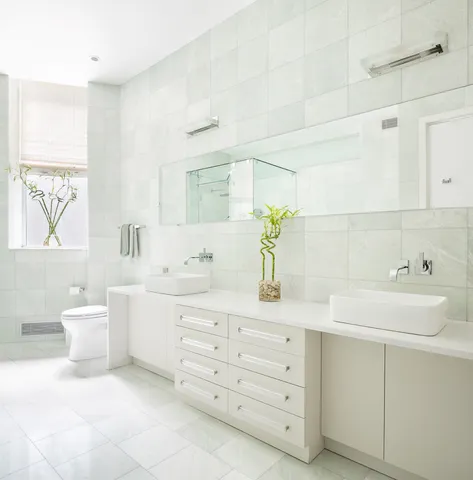 a spacious bathroom with a tub sink shower and mirror