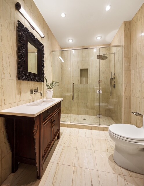 362 West Broadway, Unit 2 Manhattan, NY 10013 - Photo 12 of 13 a bathroom with a double vanity sink toilet and shower