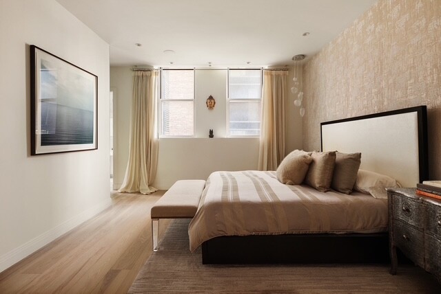 362 West Broadway, Unit 2 Manhattan, NY 10013 - Photo 7 of 13 a bedroom with a bed and a painting on the wall