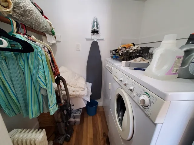 a view of a bedroom with a bed and large closet