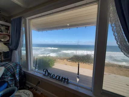 a living room with furniture and a book shelf