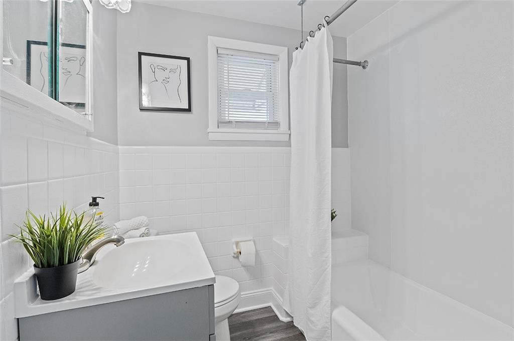 716 School Street McKees Rocks, PA 15136 - Photo 17 of 25 a bathroom with a sink a toilet and a shower
