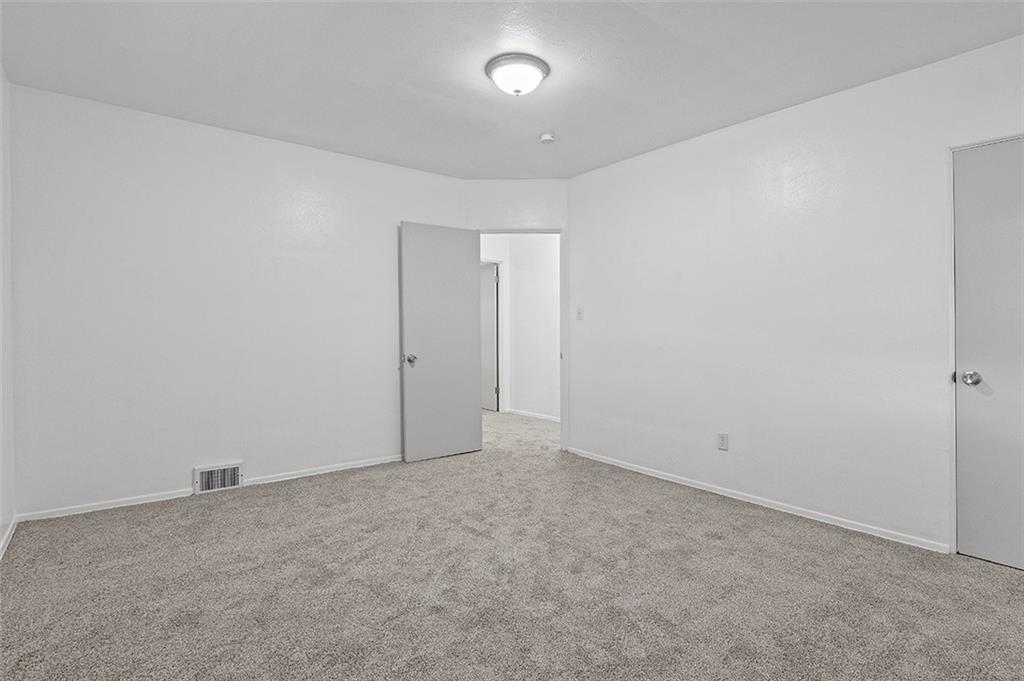 716 School Street McKees Rocks, PA 15136 - Photo 18 of 25 an empty room with a fan & a window
