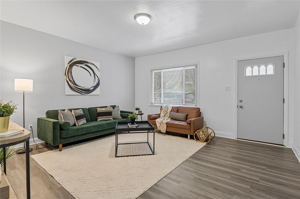 716 School Street McKees Rocks, PA 15136 - Photo 3 of 25 a living room with furniture and a wooden floor