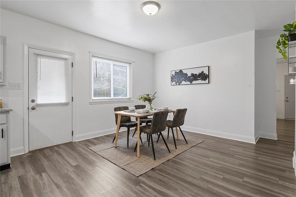 716 School Street McKees Rocks, PA 15136 - Photo 7 of 25 a view of a dining room with furniture and wooden floor
