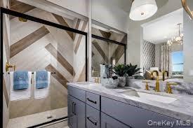 25 Fieldstone, Unit 35 Armonk, NY 10504 - Photo 12 of 16 a bathroom with a sink and a mirror