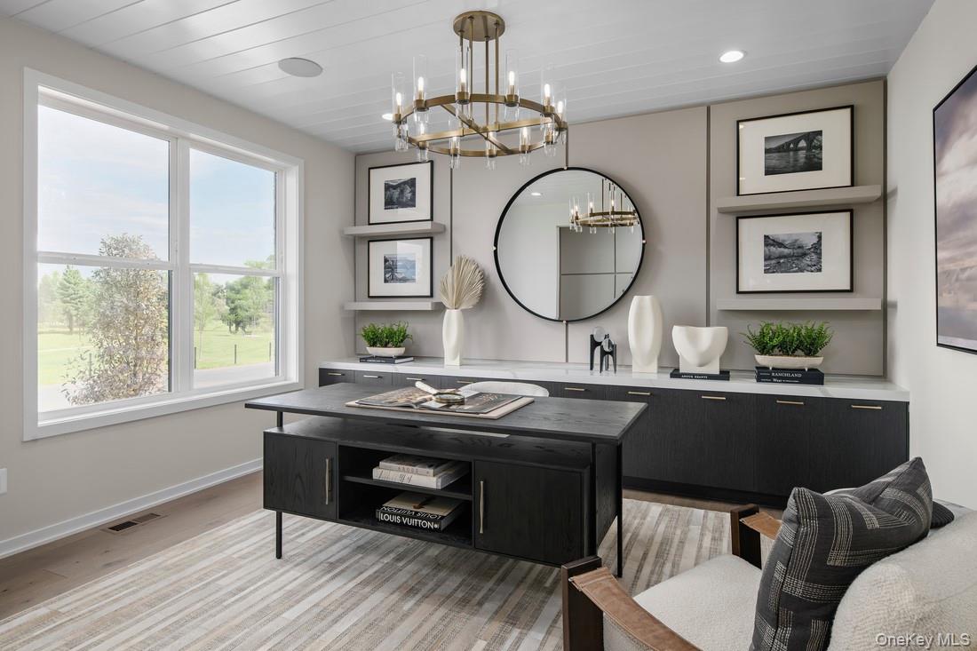 25 Fieldstone, Unit 35 Armonk, NY 10504 - Photo 3 of 16 a view of a dining room with furniture window and wooden floor