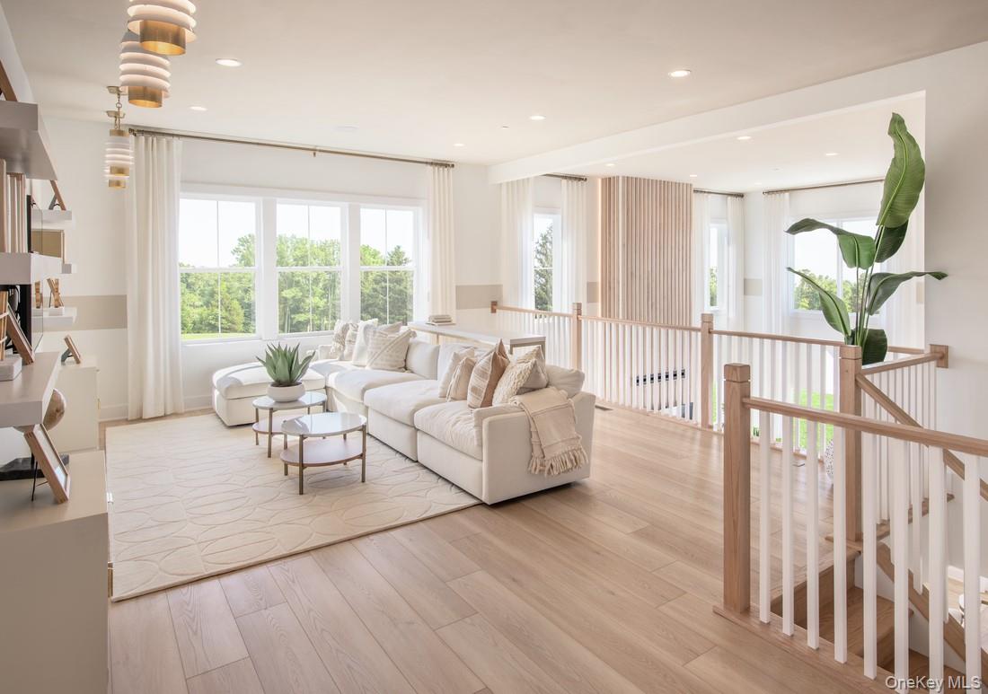 25 Fieldstone, Unit 35 Armonk, NY 10504 - Photo 10 of 16 a living room with furniture and wooden floor