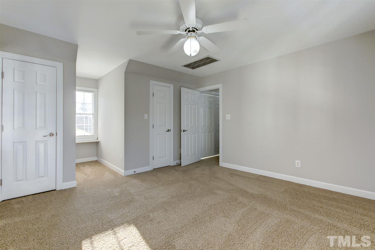 7220 Ridgeline Drive Raleigh, NC 27613 - Photo 11 of 16 This bedroom is used as a bonus room since the septic is a 4 bedroom septic. Plenty of closet and storage space allow options for this room's use. There's also a huge walk-up attic for additional storage space.
