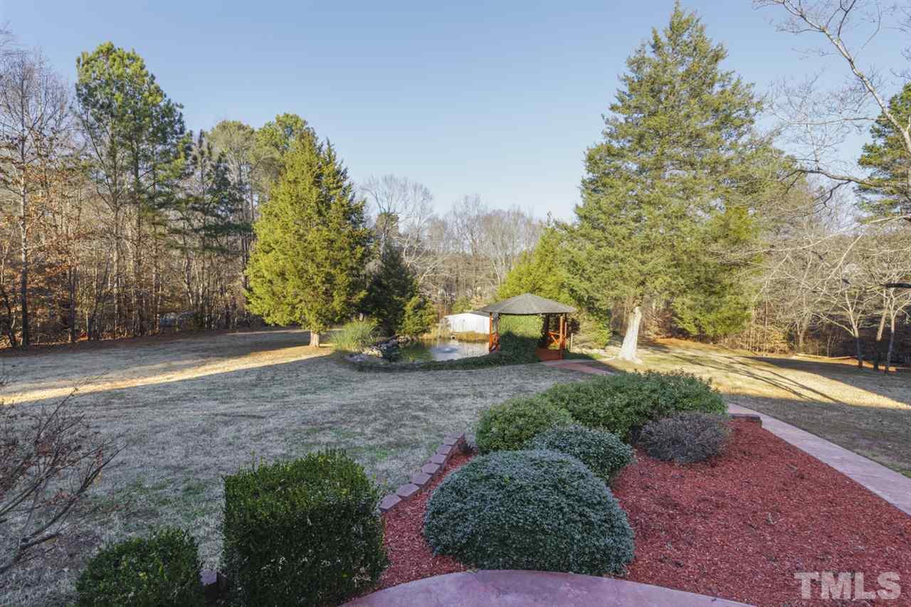 7220 Ridgeline Drive Raleigh, NC 27613 - Photo 15 of 16 This view of the private landscaped yard shows how much room you have to enjoy the outdoors.