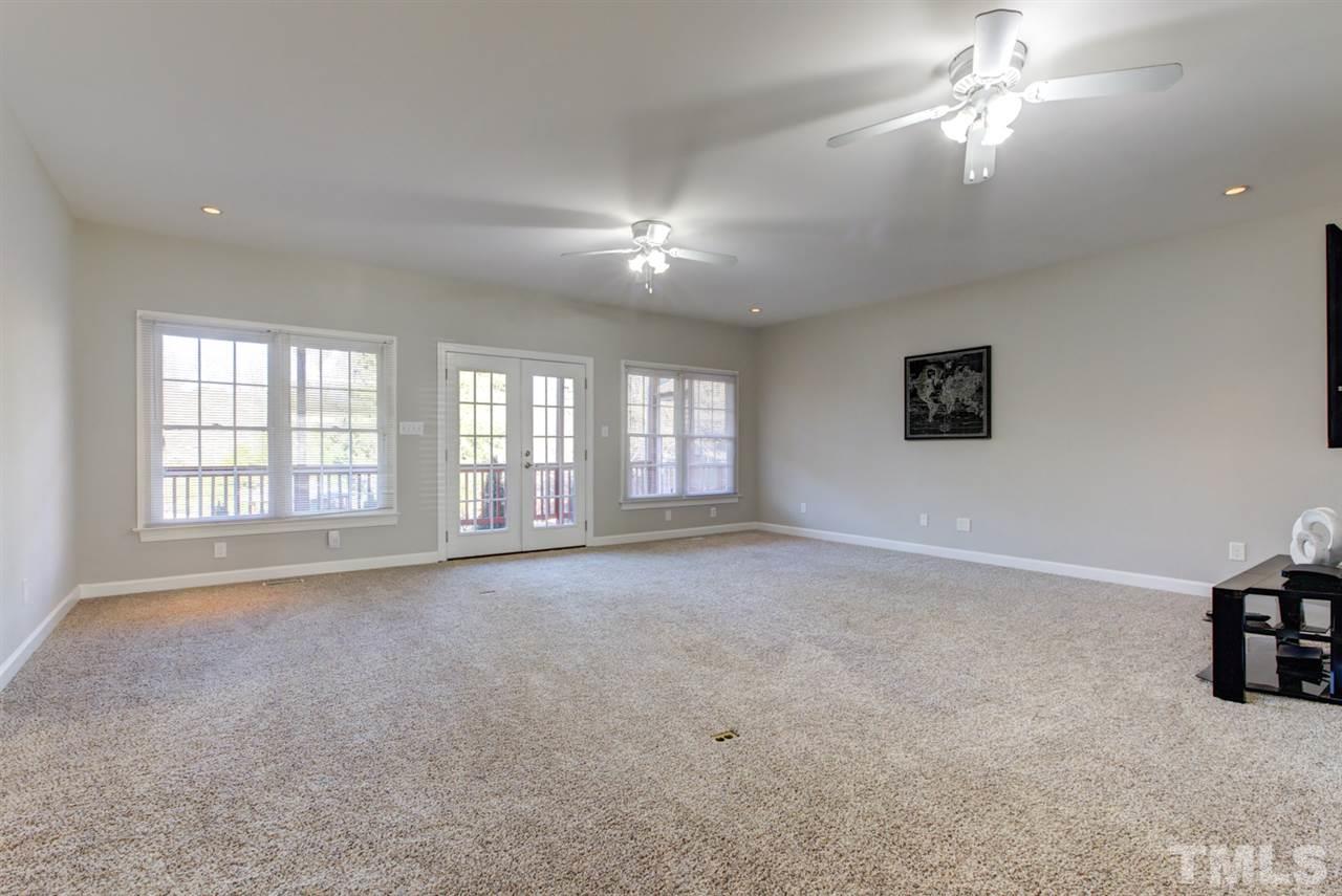 7220 Ridgeline Drive Raleigh, NC 27613 - Photo 3 of 16 The family room is huge! Plenty of space for relaxing and entertaining. Great access to the deck makes grilling out a breeze.