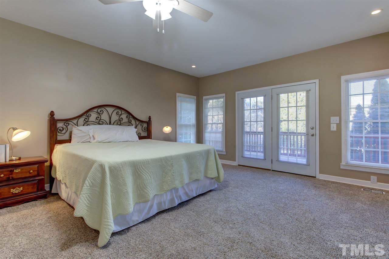 7220 Ridgeline Drive Raleigh, NC 27613 - Photo 5 of 16 In-Law suite or first floor master -you choose. There's tons of privacy, a laundry room and lots of closet and storage space. You can also access the screen porch and deck which overlooks the private yard.