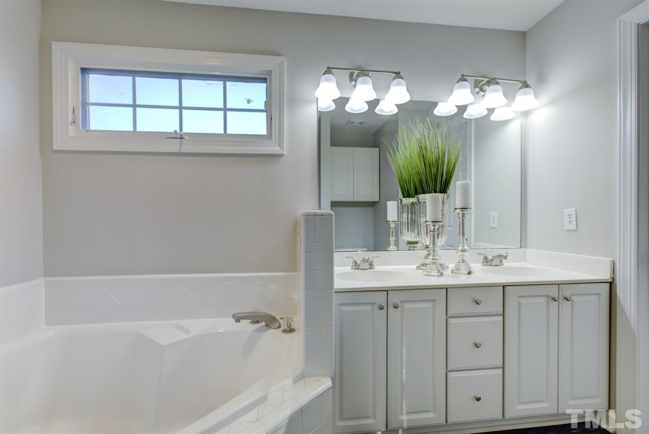 7220 Ridgeline Drive Raleigh, NC 27613 - Photo 9 of 16 Dual Vanities, Garden Tub, separate shower and lots of natural light are great features of the master bath. There's also a huge walk-in closet.