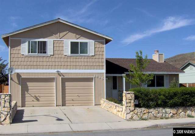 1235 Autumn Reno, NV 89511 - Photo 1 of 9 a front view of a house with a yard