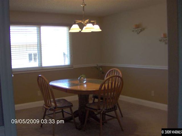 1235 Autumn Reno, NV 89511 - Photo 4 of 9 a view of a dining room with furniture and window