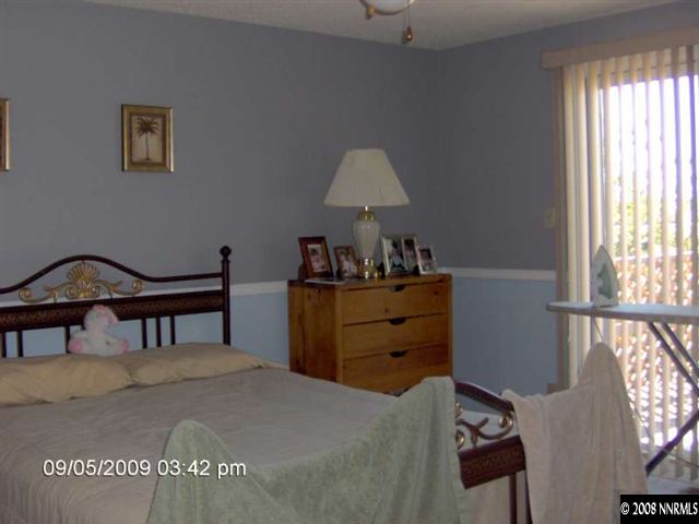 1235 Autumn Reno, NV 89511 - Photo 6 of 9 a bedroom with a bed and a window
