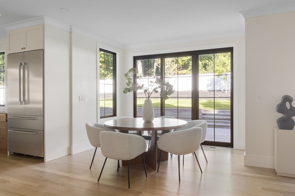 310 Oakland Street Wellesley, MA 02481 - Photo 11 of 33 a view of a dining room with furniture window and wooden floor