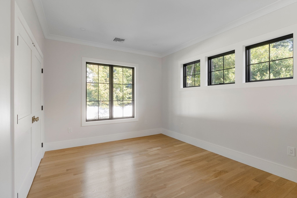 310 Oakland Street Wellesley, MA 02481 - Photo 16 of 33 a view of an empty room with a window