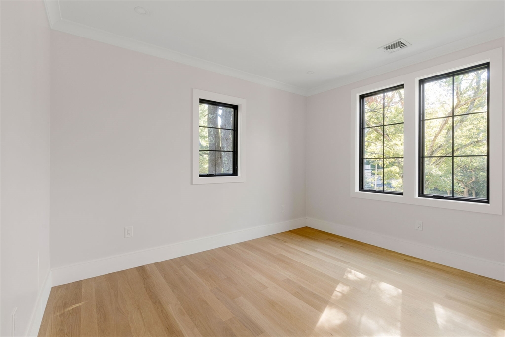 310 Oakland Street Wellesley, MA 02481 - Photo 17 of 33 an empty room with a window