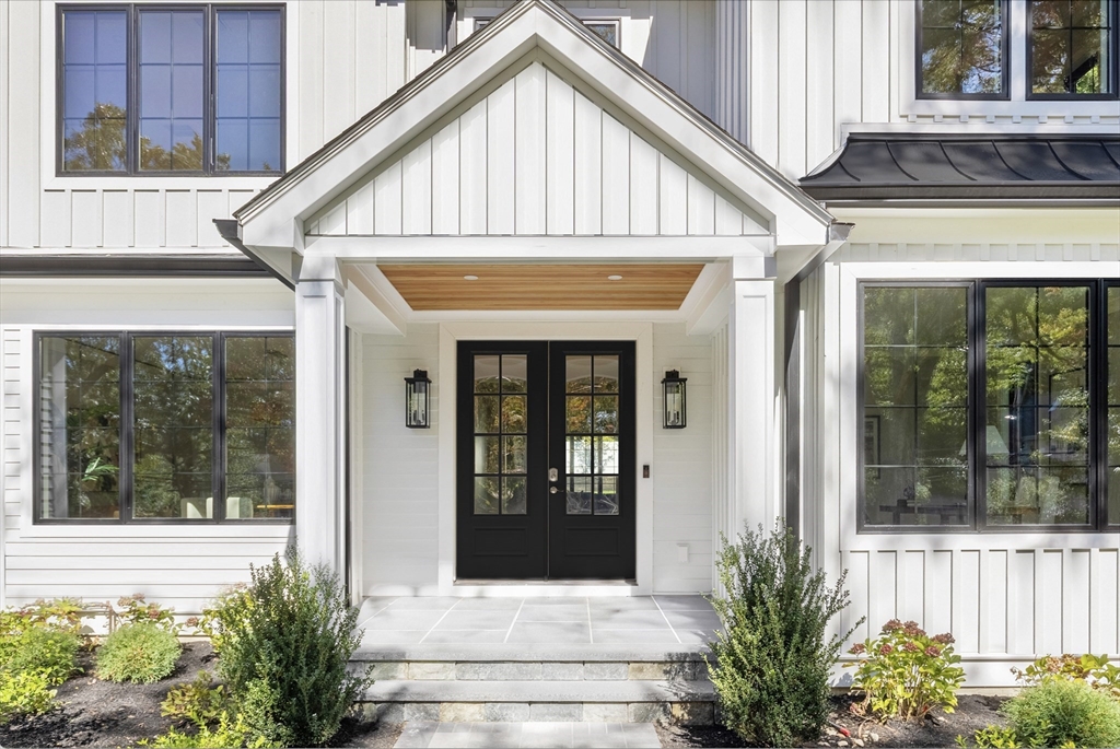 310 Oakland Street Wellesley, MA 02481 - Photo 2 of 33 a front view of a house with a yard