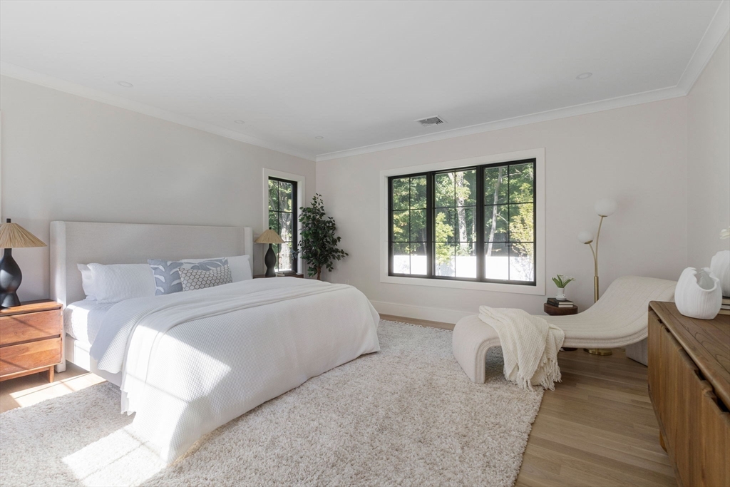 310 Oakland Street Wellesley, MA 02481 - Photo 21 of 33 a bedroom with a bed and a large window