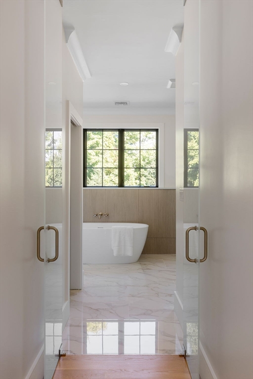 310 Oakland Street Wellesley, MA 02481 - Photo 22 of 33 a living room with a couch and window