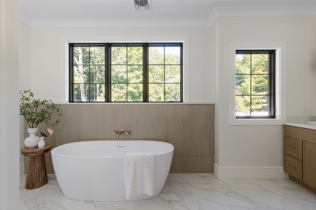 310 Oakland Street Wellesley, MA 02481 - Photo 23 of 33 a white bath tub sitting in a bathroom next to a window