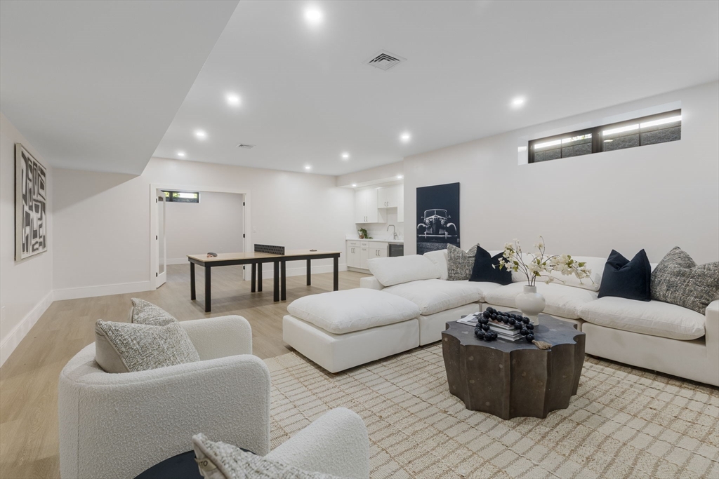 310 Oakland Street Wellesley, MA 02481 - Photo 26 of 33 a living room with furniture and a wooden floor