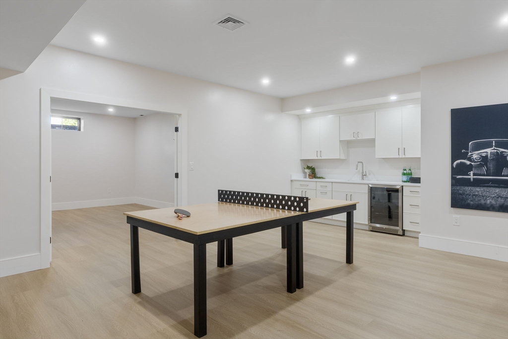 310 Oakland Street Wellesley, MA 02481 - Photo 28 of 33 a room with a table chairs and wooden floor