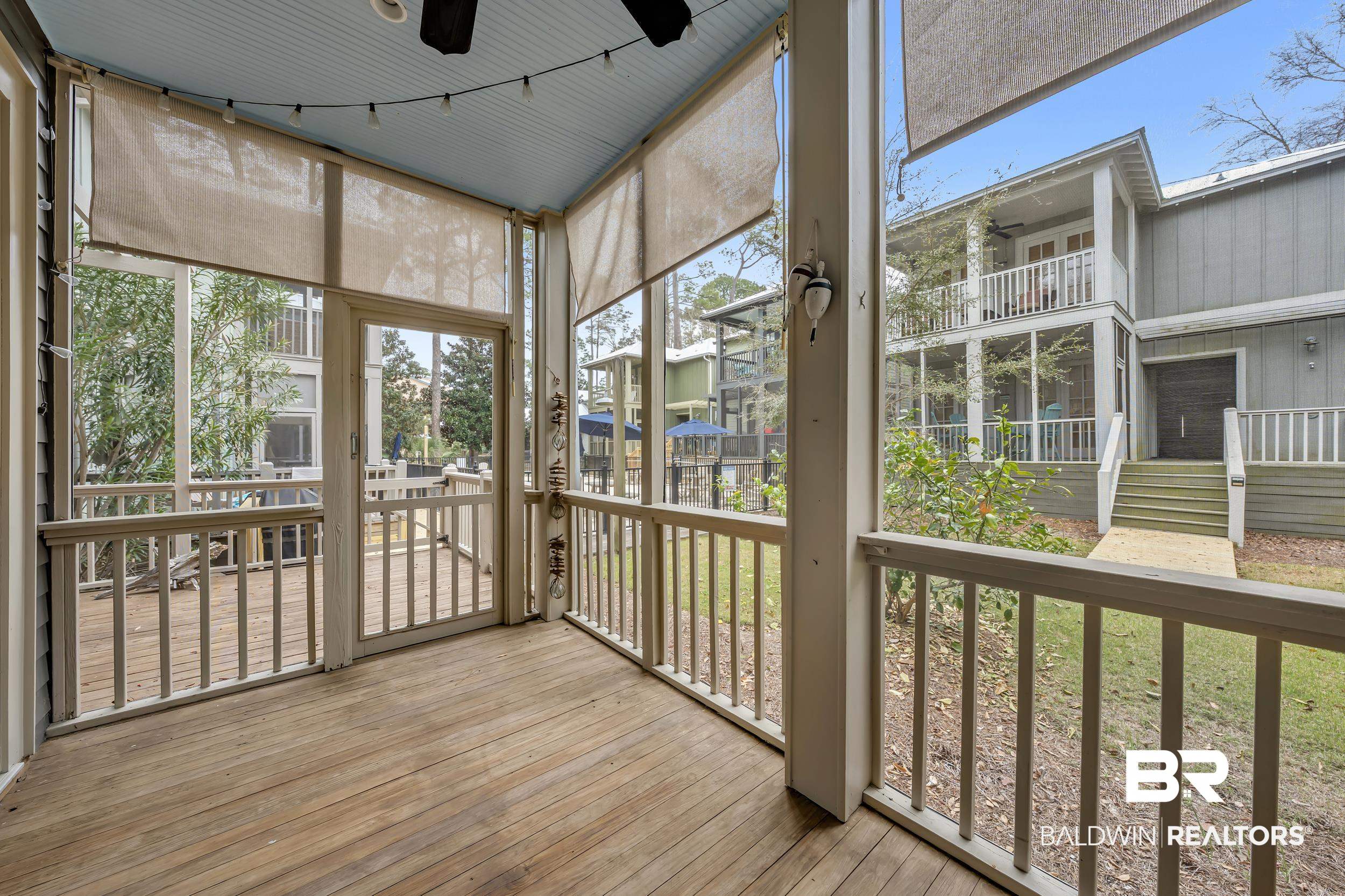 25773 Canal Road, Unit 32 Orange Beach, AL 36561 - Photo 13 of 35 Unfurnished sunroom with a ceiling fan and healthy amount of natural light