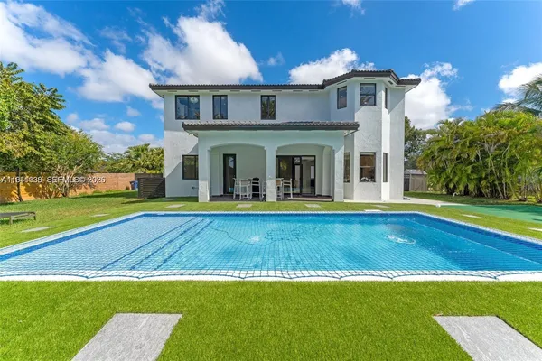 a view of pool with yard