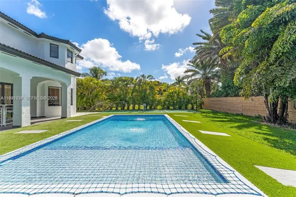 a view of swimming pool with a yard
