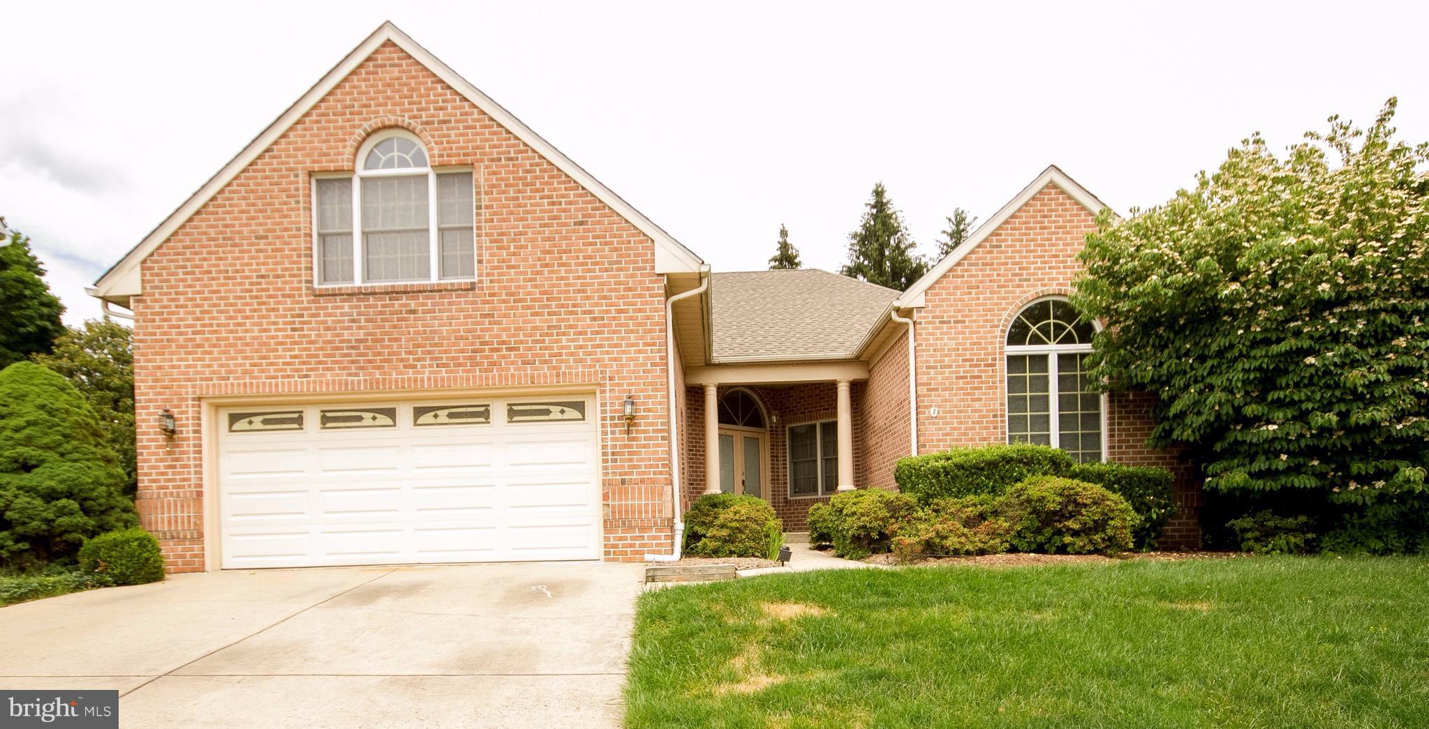 a view of a house with a yard and plants