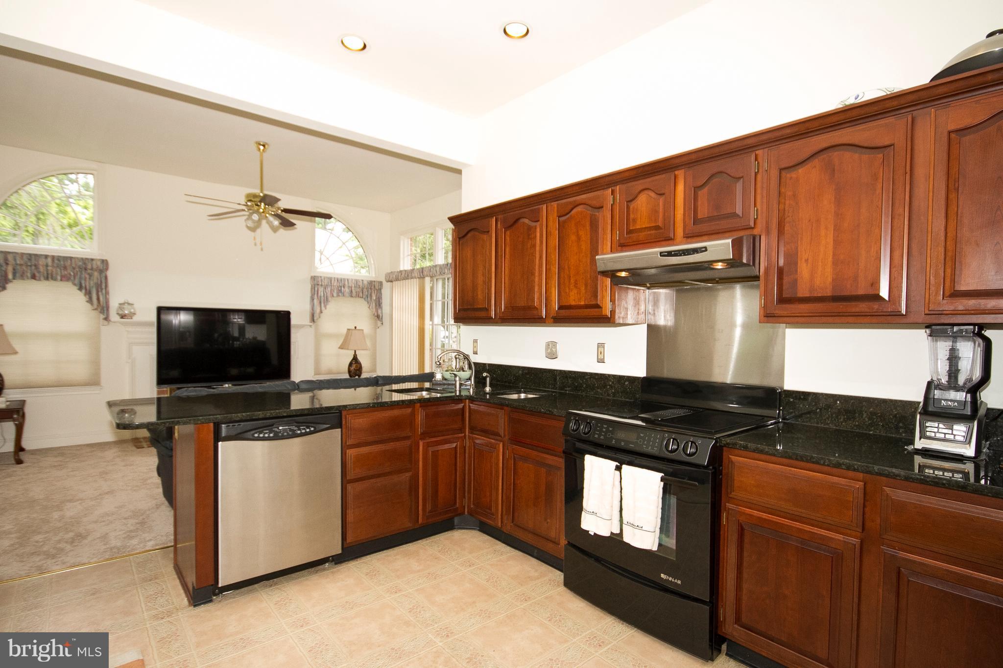4 Roland Place Bel Air, MD 21014 - Photo 12 of 22 a kitchen with stainless steel appliances granite countertop a stove a sink and a microwave