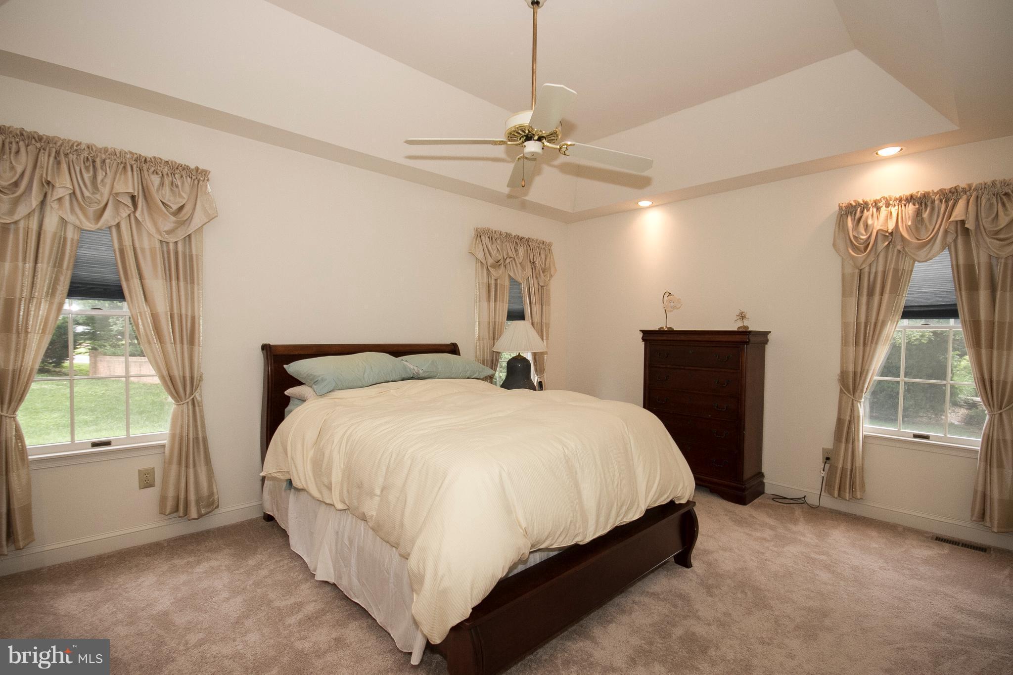 4 Roland Place Bel Air, MD 21014 - Photo 16 of 22 a large bed sitting in a room next to a window