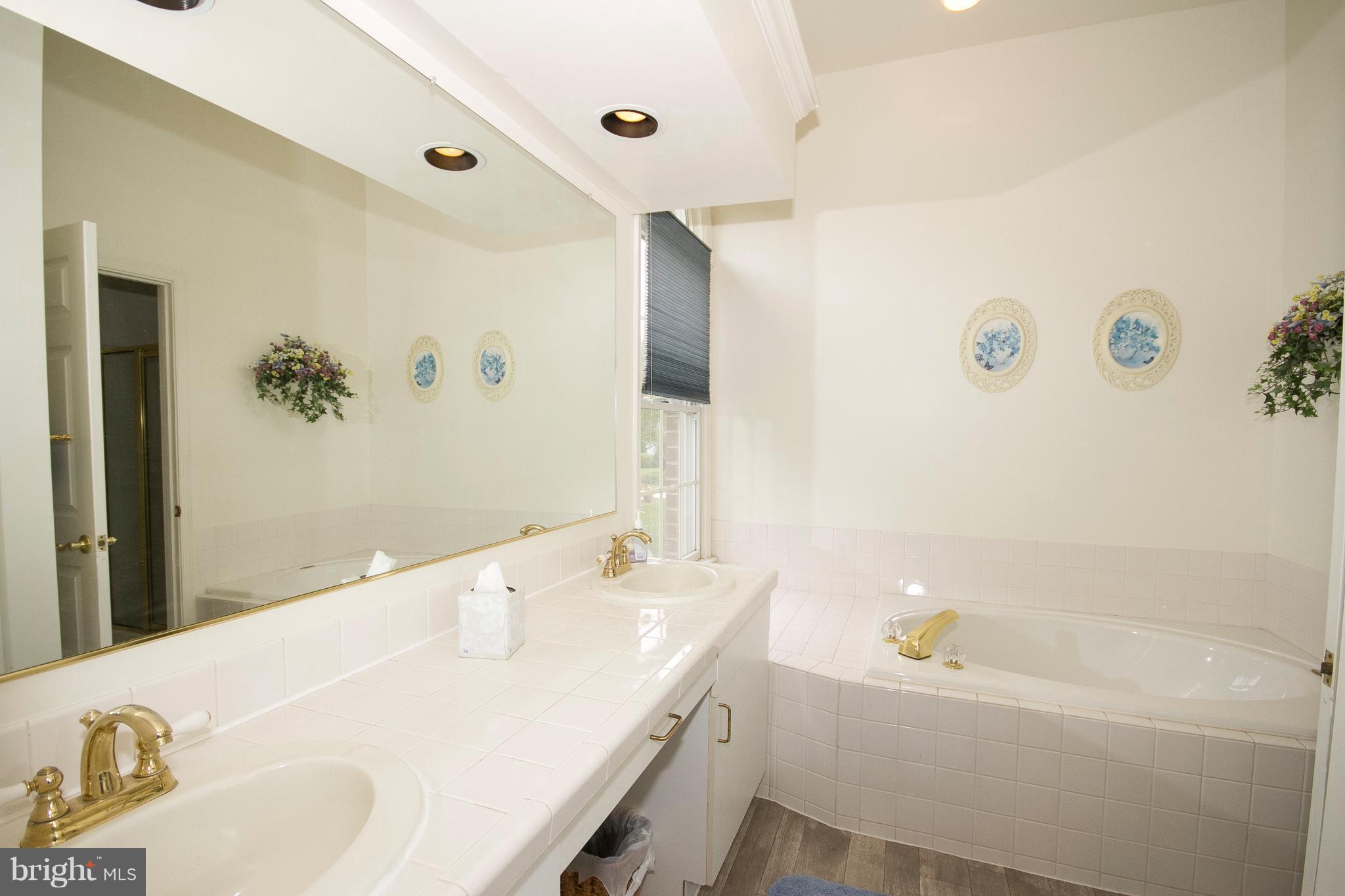 4 Roland Place Bel Air, MD 21014 - Photo 17 of 22 a bathroom with a tub sink and mirror