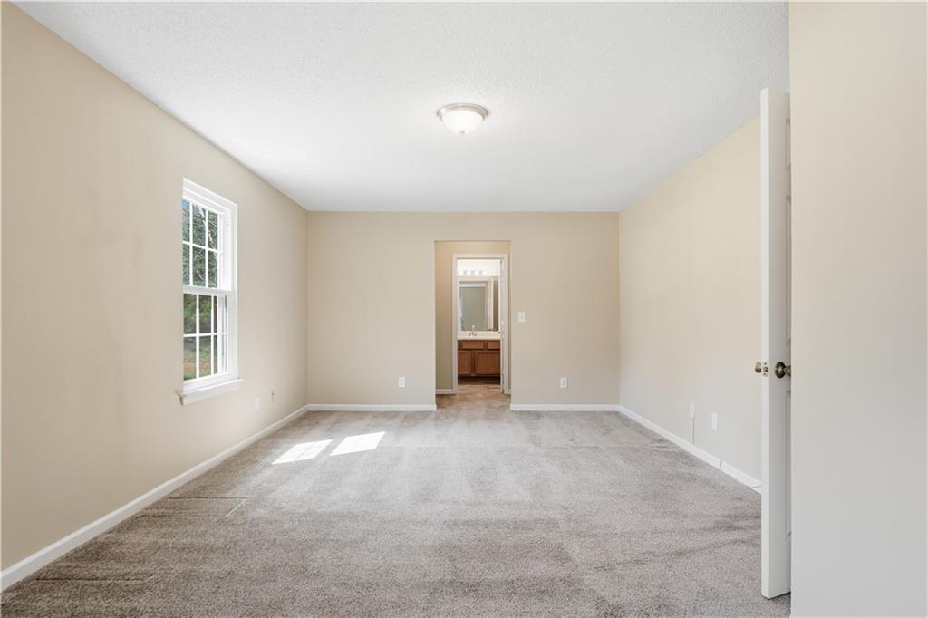 1488 Bellemeade Farms Road Southwest Marietta, GA 30008 - Photo 21 of 31 an empty room with windows