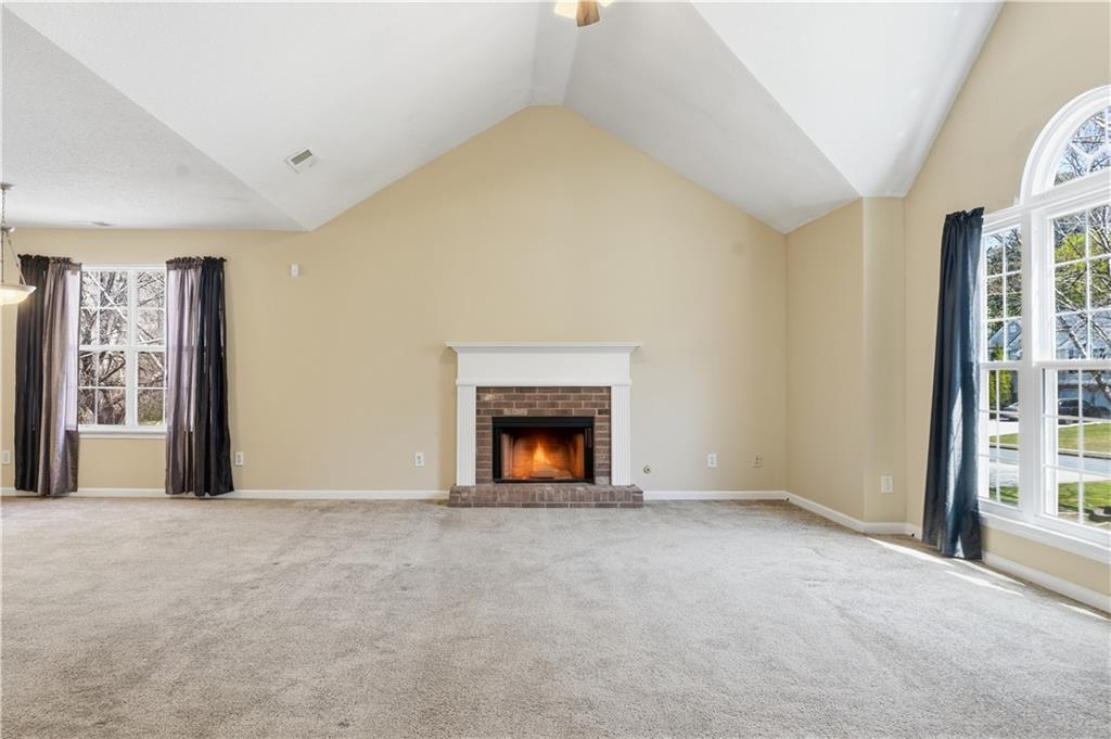 1488 Bellemeade Farms Road Southwest Marietta, GA 30008 - Photo 5 of 31 a view of an empty room with a window and fireplace