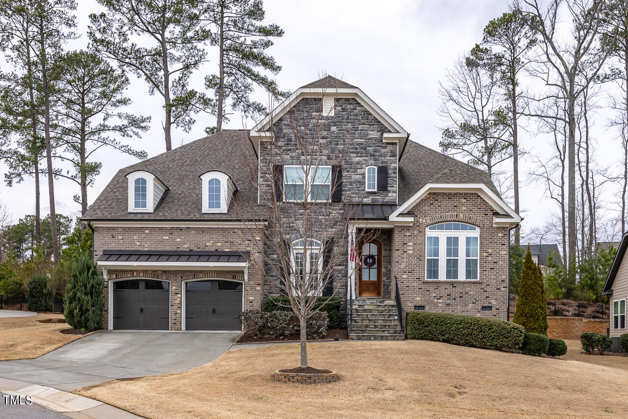 5109 Landguard Drive Raleigh, NC 27613 - Photo 1 of 47 a front view of a house with yard
