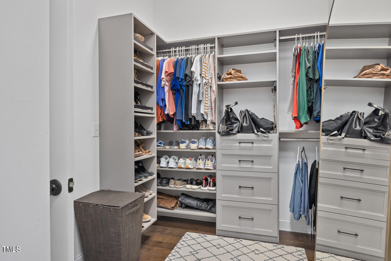 5109 Landguard Drive Raleigh, NC 27613 - Photo 37 of 47 a view of walk in closet with clothes and shoes