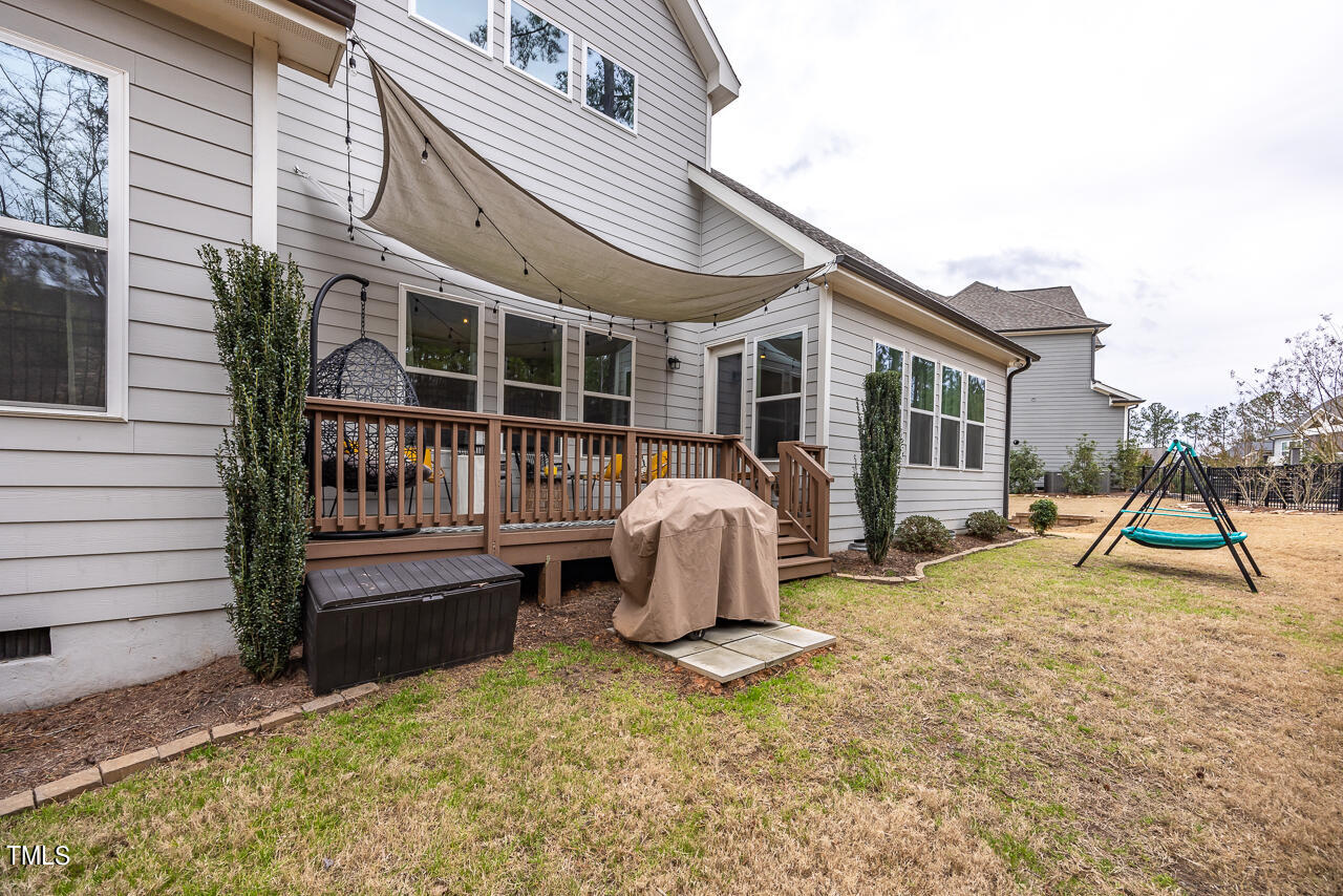 5109 Landguard Drive Raleigh, NC 27613 - Photo 40 of 47 a view of house with a patio and wooden fence