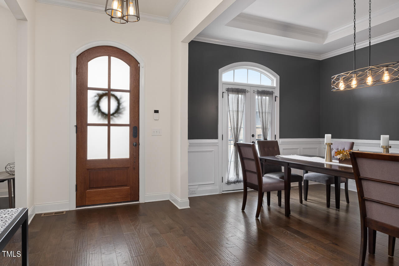 5109 Landguard Drive Raleigh, NC 27613 - Photo 4 of 47 a view of a dining room with furniture window and wooden floor