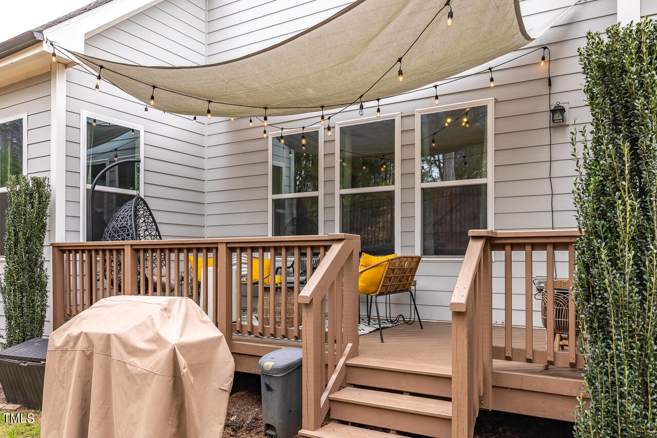 5109 Landguard Drive Raleigh, NC 27613 - Photo 41 of 47 a view of a chair and tables in the balcony