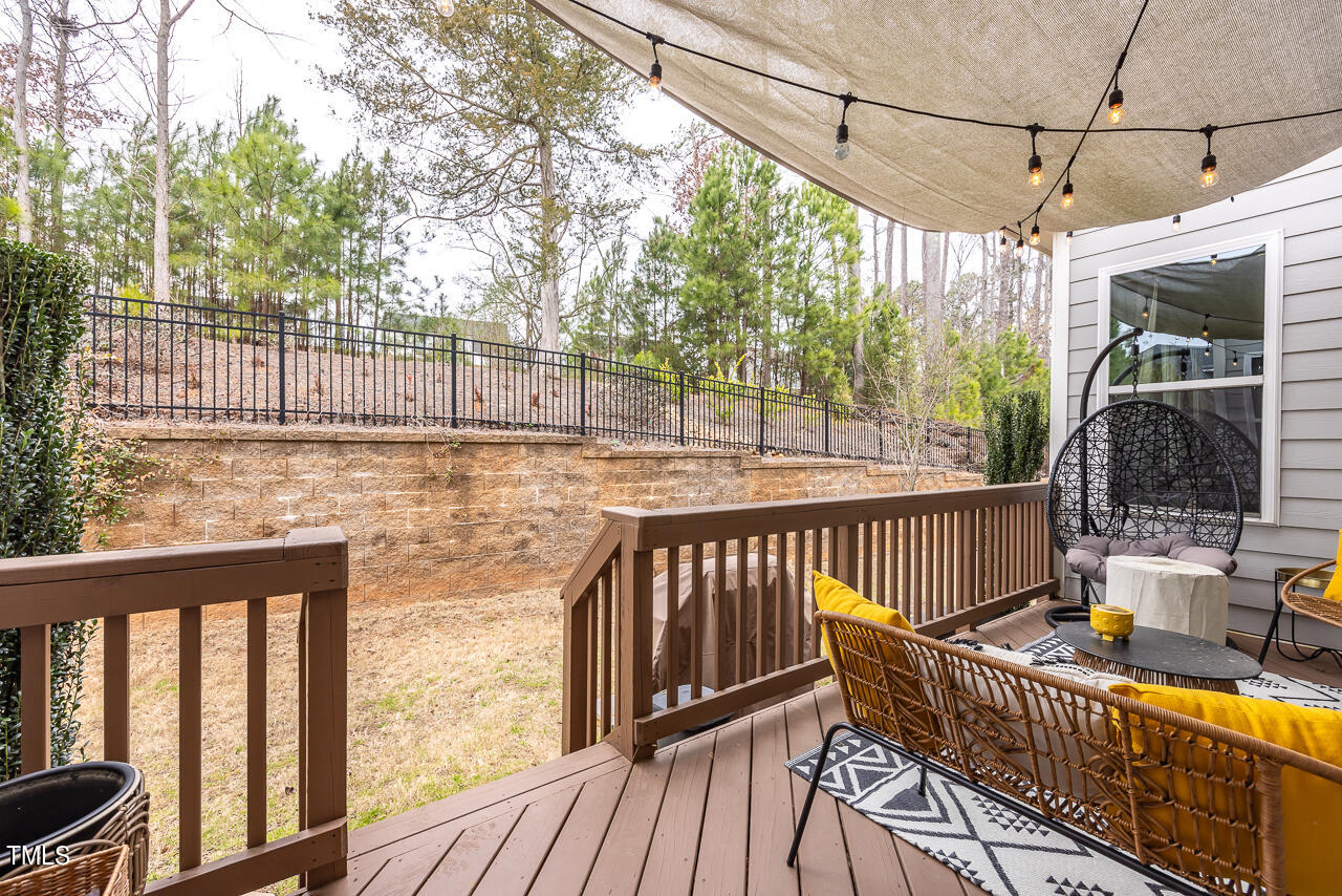 5109 Landguard Drive Raleigh, NC 27613 - Photo 42 of 47 a view of balcony with wooden floor and outdoor seating