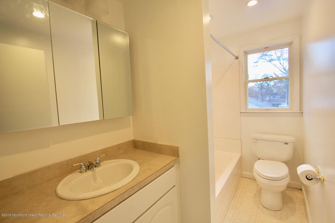 412 Ely Road Neptune Township, NJ 07753 - Photo 14 of 15 a bathroom with a sink toilet and shower