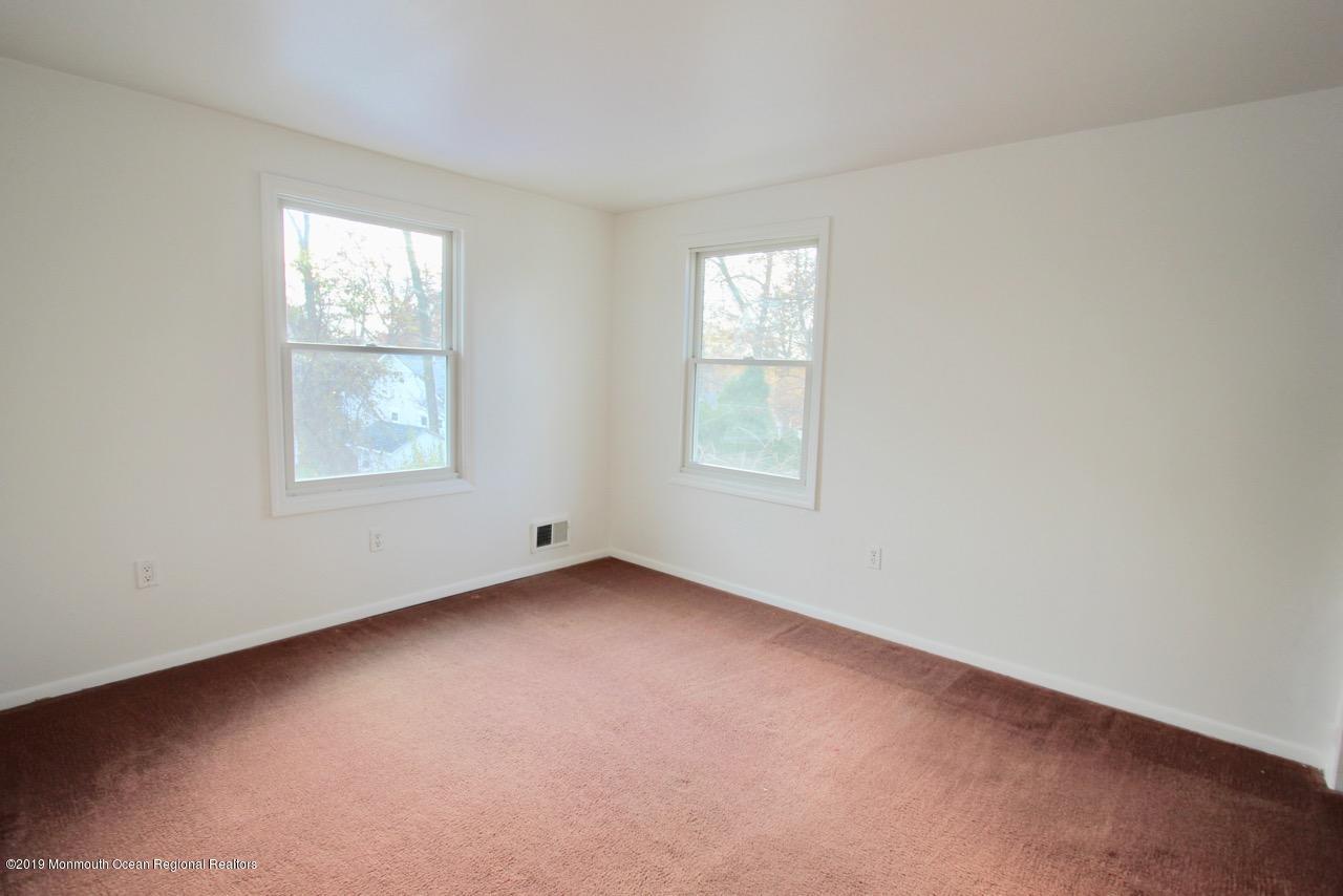 412 Ely Road Neptune Township, NJ 07753 - Photo 15 of 15 an empty room with windows