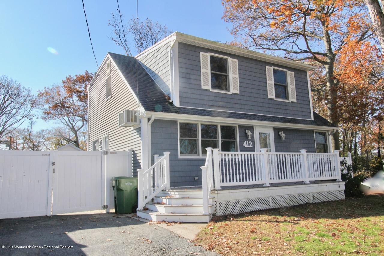 412 Ely Road Neptune Township, NJ 07753 - Photo 2 of 15 a front view of a house with a yard